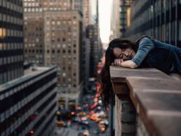 woman lying on wall in New York, lockdown fatigue