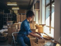 Ecommerce, Female business owner working, packing the order for shipping to customer