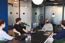 returning to the office after COVID-19, group of workers wearing masks