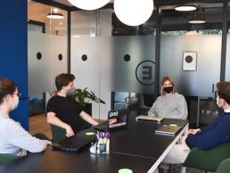 returning to the office after COVID-19, group of workers wearing masks