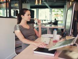Casual Creative Freelancer Woman Eating A Sandwich In Front Of A Computer, working lunch