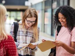 Female College Students Opening Exam Results, A-Level