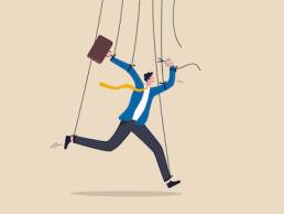 Freedom for work and decision making, authority to work independently, stop micromanagement, or people manipulation concept, businessman marionette, puppeteer use scissors to cut controlled strings.