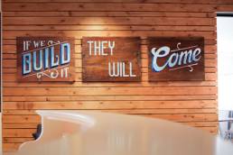 Taxi Studio, Image of an open plan office with signs saying 'If we build it, they will come'