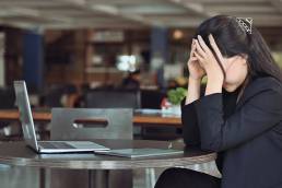 frustrated and stressed woman in office