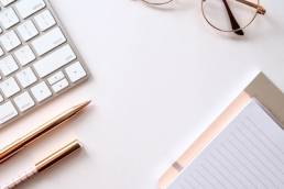 Laptop, pen and notepad on desk, working from home, PR