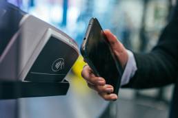 paying-on-phone--0IVop5v4MMU-unsplash