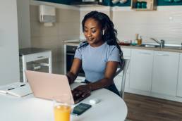 Young african america business woman working from home, female entrepreneur, hybrid working