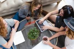 Female entrepreneurs, group of female leaders talking while working