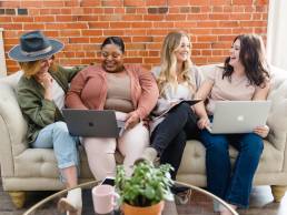 Group of happy businesswomen, female entrepreneurs in meeting