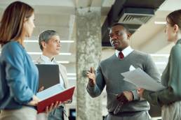 Group of employees in a meeting in a corporate office