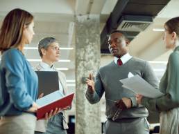 Group of employees in a meeting in a corporate office