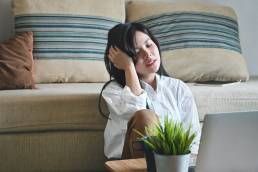 young woman suffering from overwhelm while working from home