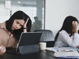 two businesswoman arguing in office, toxic behaviours in the workplace