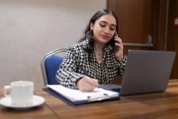 Young woman working at desk, career change