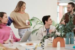 Group of employees working togetther in office