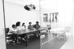 Group of women sitting in boardroom