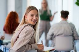Happy woman studying for diploma