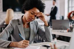 Businesswoman experiencing burnout, mental fatigue