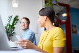 Woman smiling at male colleague, Gender equity