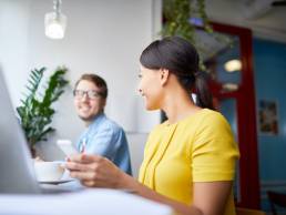 Woman smiling at male colleague, Gender equity