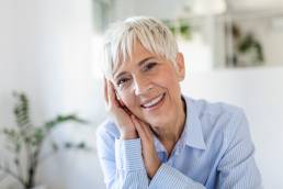 Smiling mature women at work, menopause support in the workplace