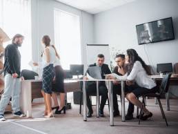 Group of colleagues in a meeting together, businesspeople, equity in the workplace