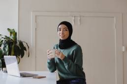 Smiling businesswoman taking part in leadership training, working from home