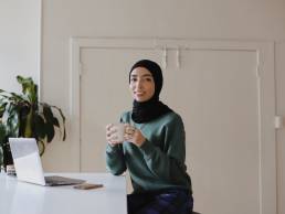 Smiling businesswoman taking part in leadership training, working from home