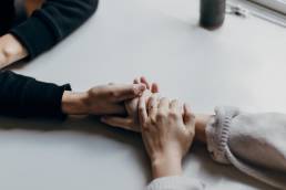 compassion, self care, two women holding hands
