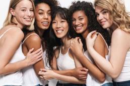 Group of diverse women smiling, international women's day