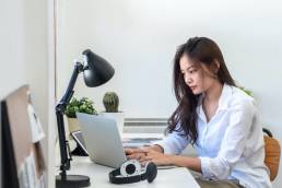 Young woman sitting at desk working