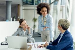 Group of female colleagues working together in office, female leadership