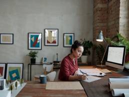 Woman working from home setting up a business, female entrepreneur