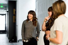 three women collaborating